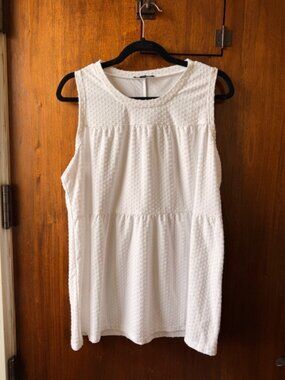 Cute white sleeveless top with "dot detailing"- perfect for summer!